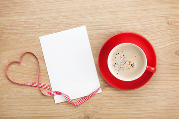 Blank valentines greeting card and red coffee cup