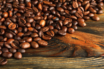 Coffee beans on wood close up