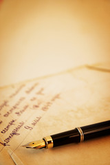 Old letters and pen as a background
