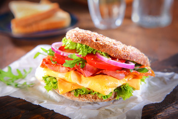 Fresh Burger with Bacon and Cheese on Paper