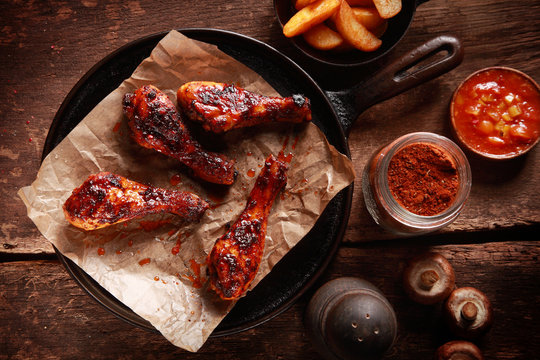 Saucy Barbecued Chicken Drumsticks on Iron Pan