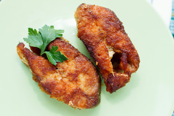 grilled pink salmon on green plate