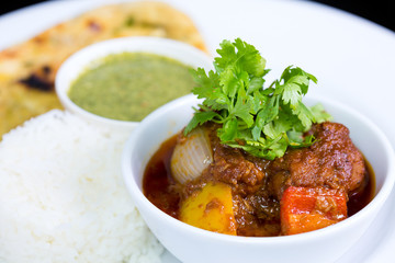 Chicken curry over steamed white rice.