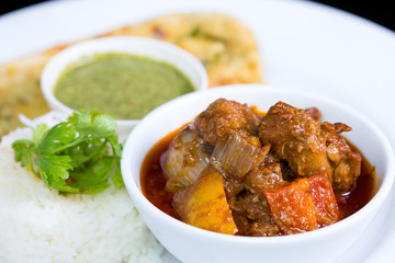 Chicken curry over steamed white rice.