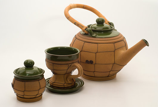 Tea pot, cup and sugar bowl