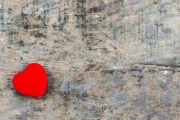 Red Valentine heart on old rustic wooden background