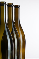 Empty bottles of wine on a glass desk