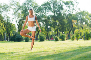 woman doing yoga in the park