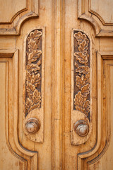 wooden leaf pattern on the door