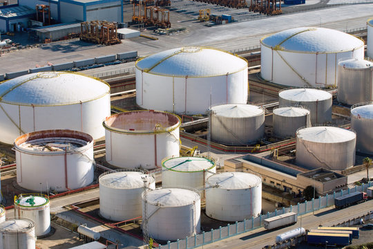Big gas storage tanks seen in a harbour
