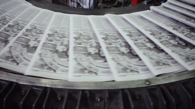 View of machine in Printing house. Semi finished product going