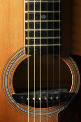 Fototapeta premium Close up of guitar resonant hole with rosette low key lighting