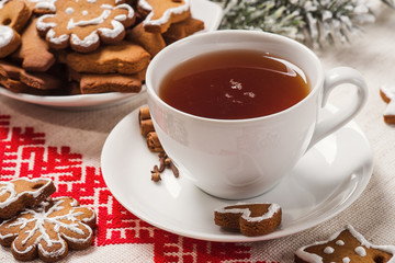 Homemade cakes in the shape Christmas cookies with a cup of blac