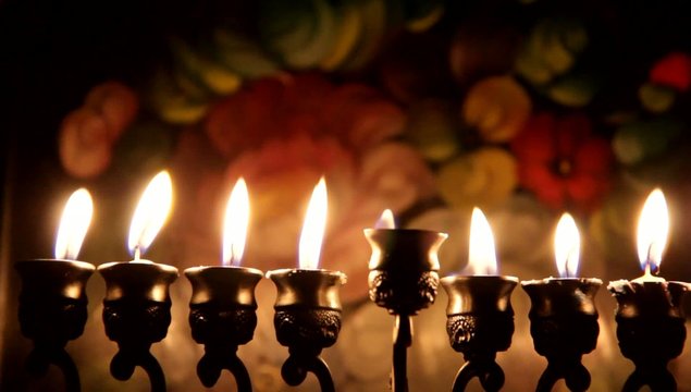 Beautiful lit hanukkah menorah on dark abstract background