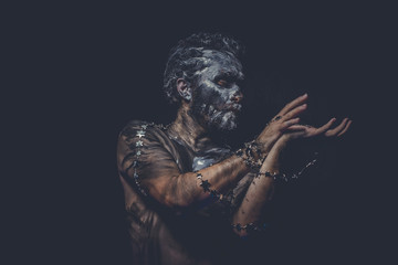 naked wild man with tribal paint