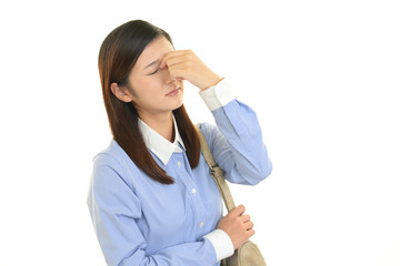 頭痛を訴えるOL