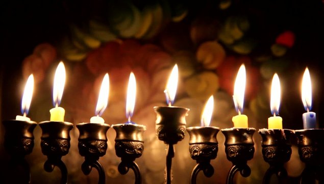 Beautiful lit hanukkah menorah on dark abstract background