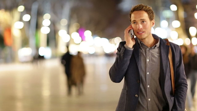 Smartphone man talking on smart phone at night