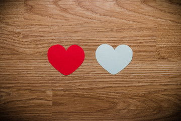 red and white heart on a wooden background