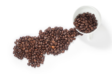 Coffee beans pouring out from a cup