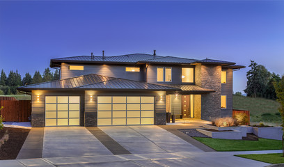 Front elevation of luxury home in evening