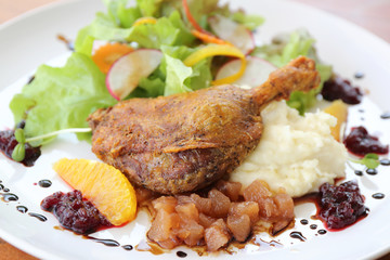 Duck confit , Roasted duck with blueberry sauce