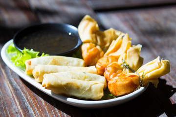 Fried wonton and spring rolls served with sweet sauce