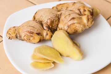Ginger Roots. Whole and sliced on plate