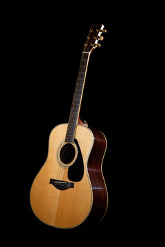 Acoustic Guitar with a dark background