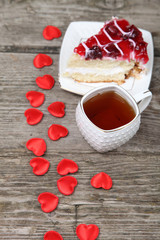 Cup of tea, piece of cake and red heart