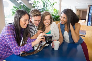 Young students looking at a camera