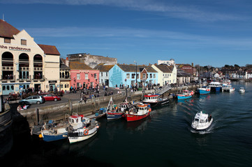 Fototapeta na wymiar Weymouth harbour on a bright sunny summer day