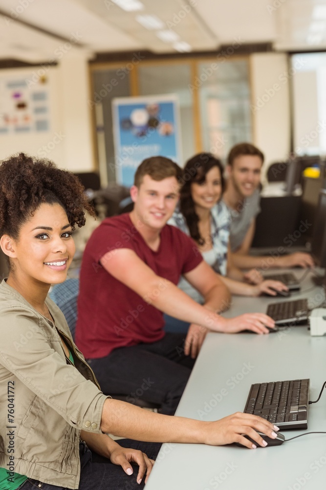 Wall mural classmates working in the computer room