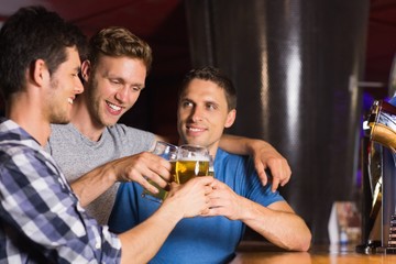 Happy friends catching up over pints