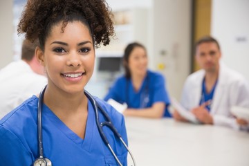 Medical student smiling at the camera during class