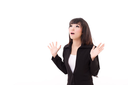exited, surprised business woman looking up to blank space