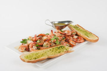 Plate with shrimps and garlic bread