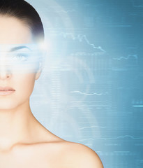 Young woman with a digital hologram on her eye. Ophthalmology an