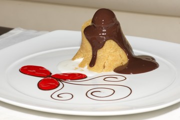 Semolina halva with red flower and cream