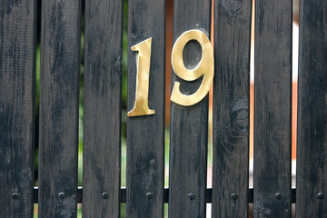 Nineteen Number Address House on Gate