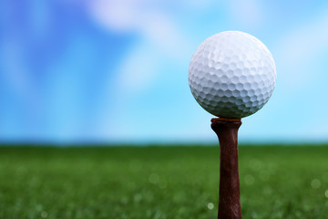 Golf ball on green grass outdoor close up