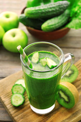 Green fresh healthy juice with fruits and vegetables