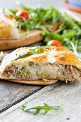 pie of puff pastry with tuna, rice and egg