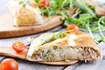 pie of puff pastry with tuna, rice and egg