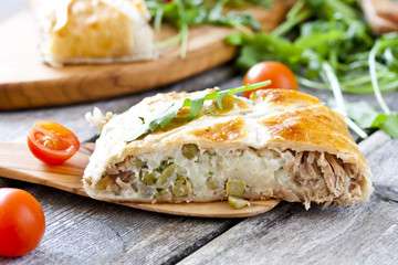 pie of puff pastry with tuna, rice and egg