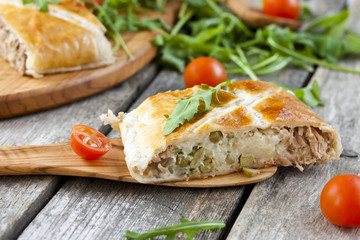 pie of puff pastry with tuna, rice and egg