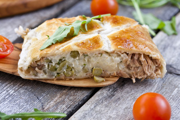 pie of puff pastry with tuna, rice and egg