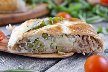 pie of puff pastry with tuna, rice and egg