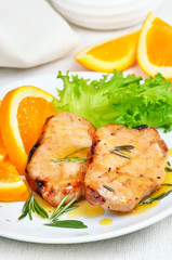 Pork cutlets with orange sauce
