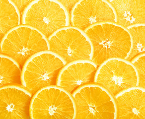 Background of heap fresh yellow lemon slices.